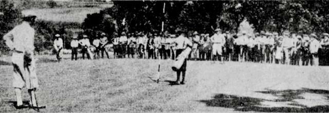 Mitchell_getting_ready_to_putt_and_Duncan_at_the_left_watching